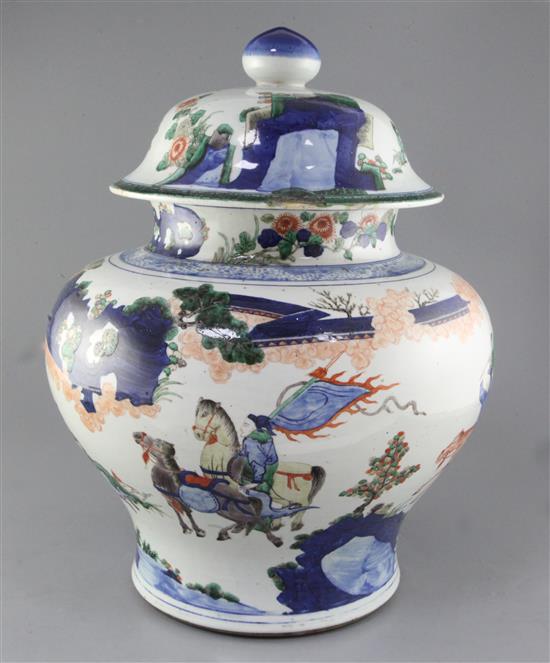 A massive Chinese wucai baluster jar and cover, early Kangxi period, c.1670, approx. height 50cm width 37cm, slight faults